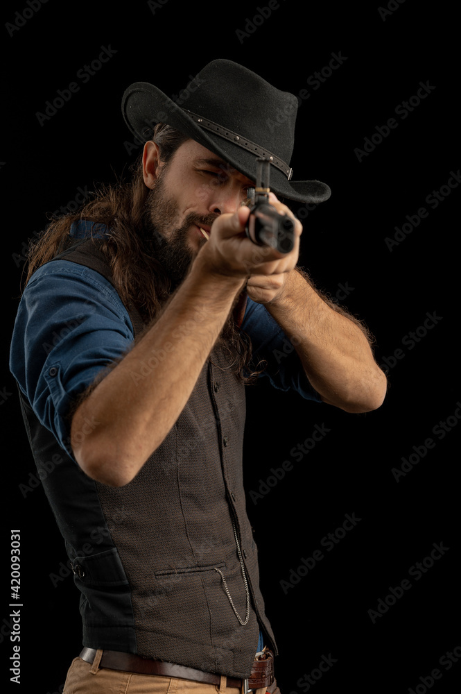Cowboy with guns. Studio shooting Cowboy with guns. Studio shooting