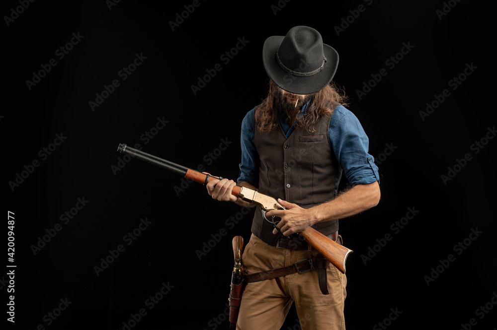 Cowboy with guns. Studio shooting Cowboy with guns. Studio shooting