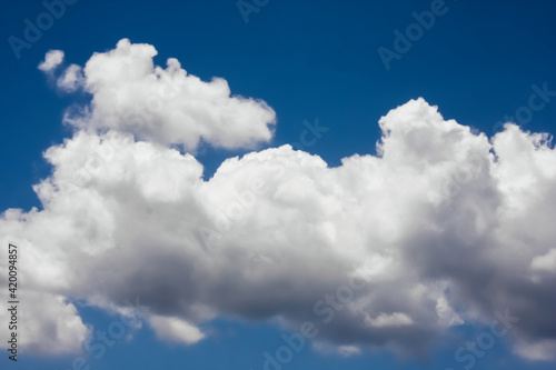 white fluffy clouds with bue sky - wallpaper