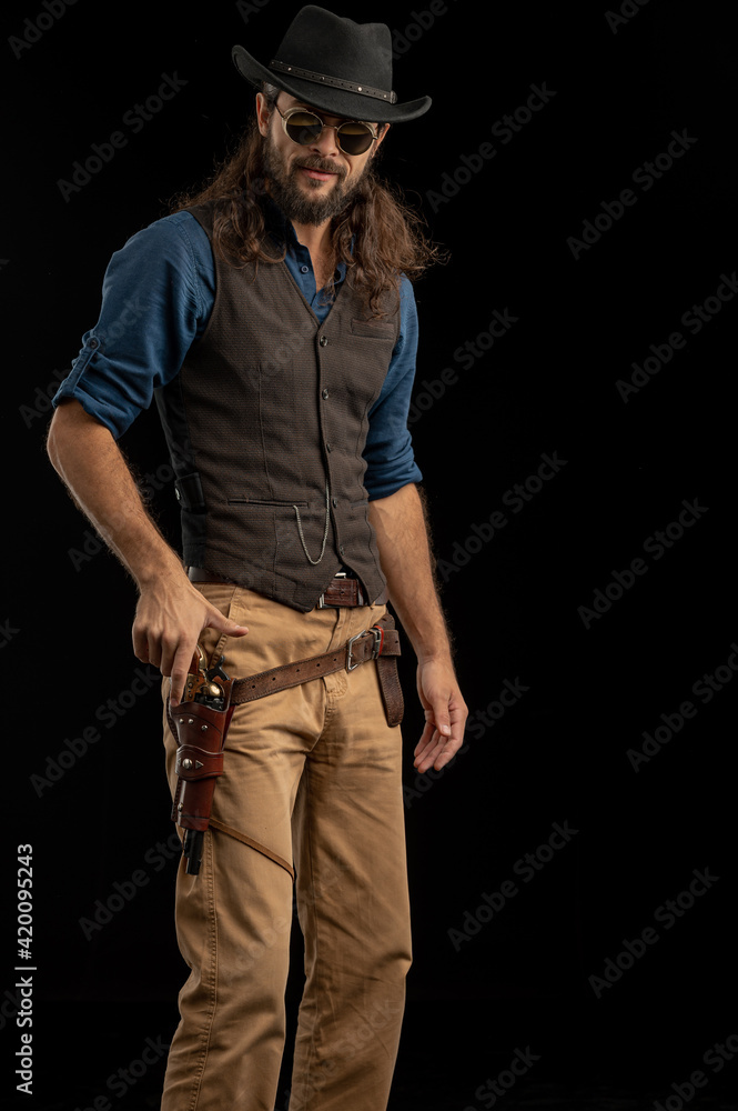 Cowboy with guns. Studio shooting Cowboy with guns. Studio shooting