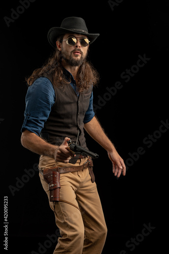 Cowboy with guns. Studio shooting © algrigo
