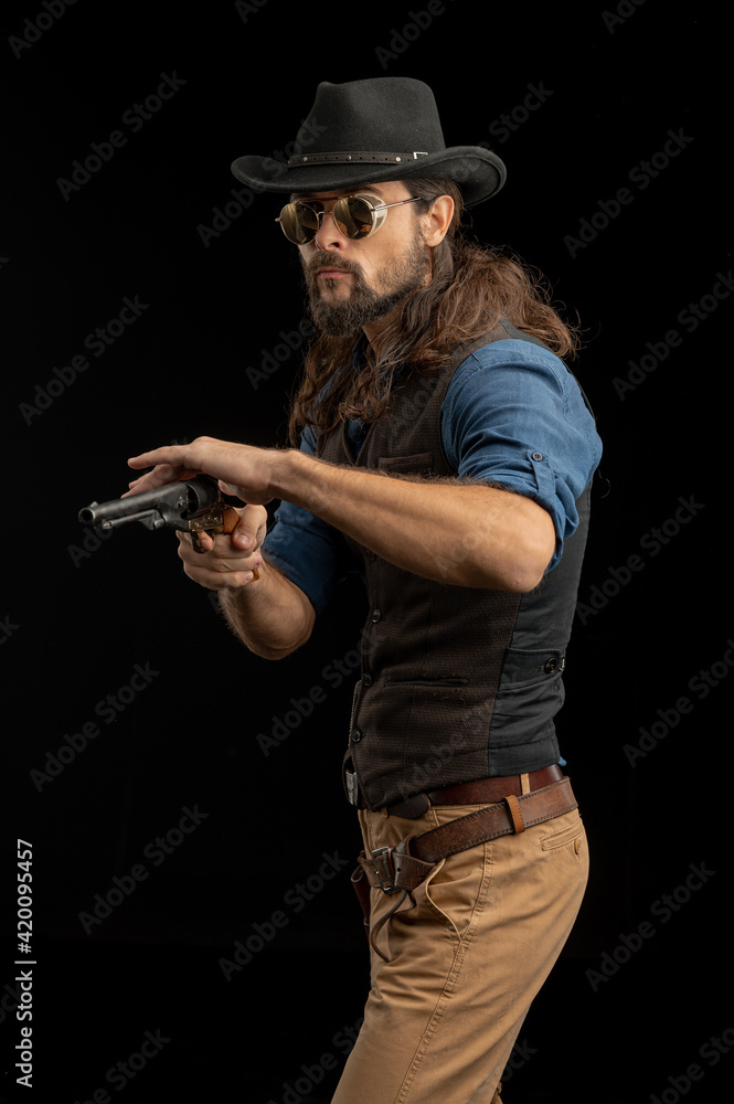 Cowboy with guns. Studio shooting Cowboy with guns. Studio shooting
