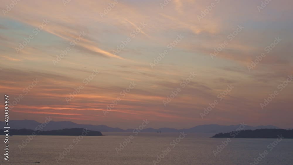 beautiful red sky in sunrise above archipelago in Phang Nga bay.between Ao Por bay in Phuket island and Phang Nga .there have many islands beautiful red sky in sunrise above archipelago in Phang Nga bay.between Ao Por bay in Phuket island and Phang Nga .there have many islands