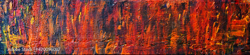 Background texture in oranges, reds and yellows for concepts, designs & ideas on fire, halloween, autumn - abstract art in panorama / header / banner style.