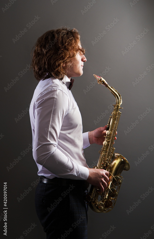 Fototapeta premium young saxophone player