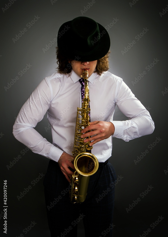 Fototapeta premium young saxophone player