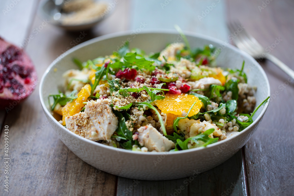 Salad with buckwheat, orange and pomegranate seeds, chicken and halloumi Salad with buckwheat, orange and pomegranate seeds, chicken and halloumi