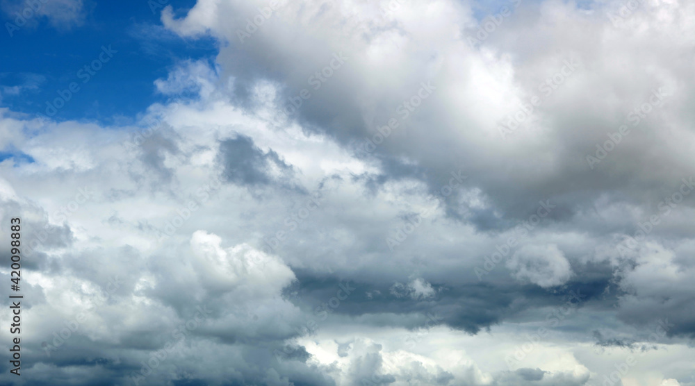 Obraz premium Dark blue ominous grey storm clouds. Dramatic