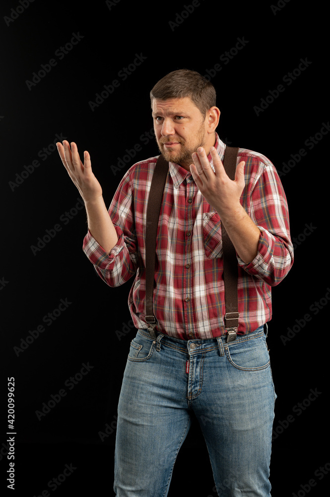 Young stylish man. Studio photo on a black background. Young stylish man. Studio photo on a black background.