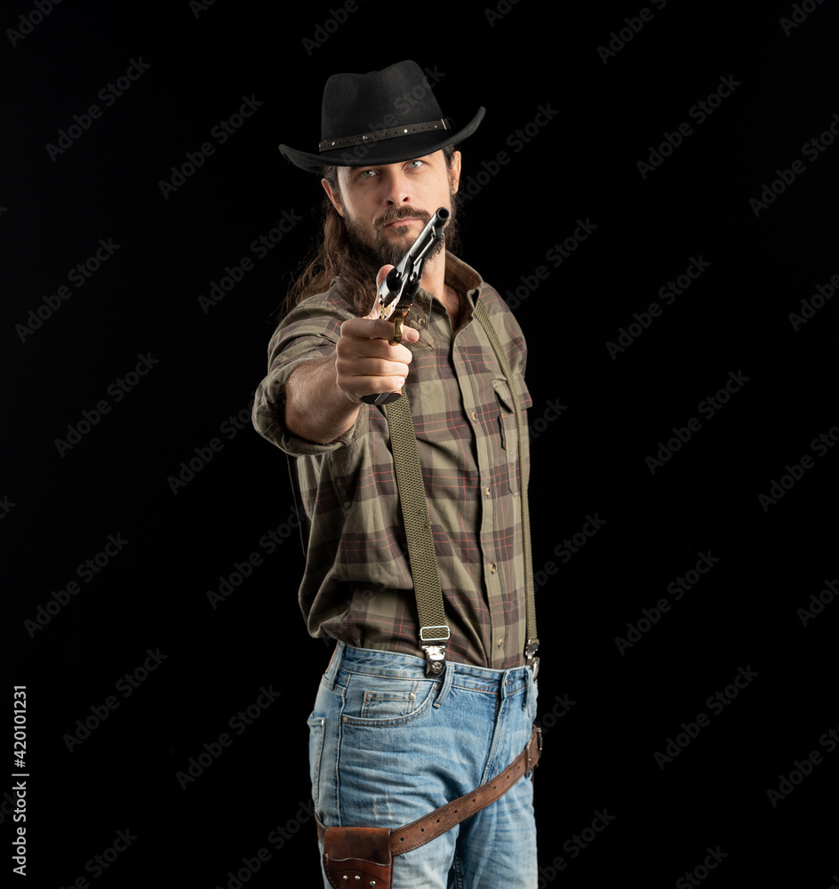 Cowboy with guns. Studio shooting Cowboy with guns. Studio shooting