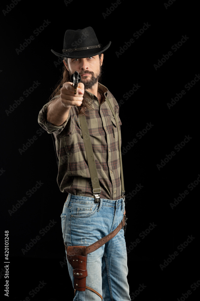 Cowboy with guns. Studio shooting Cowboy with guns. Studio shooting