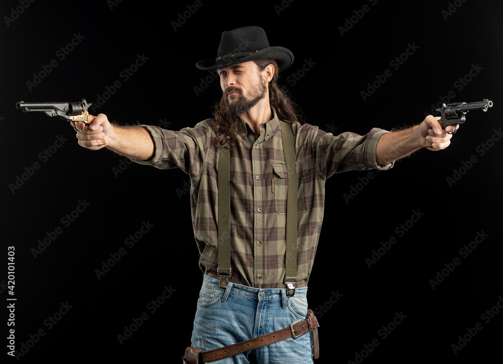 Cowboy with guns. Studio shooting Cowboy with guns. Studio shooting