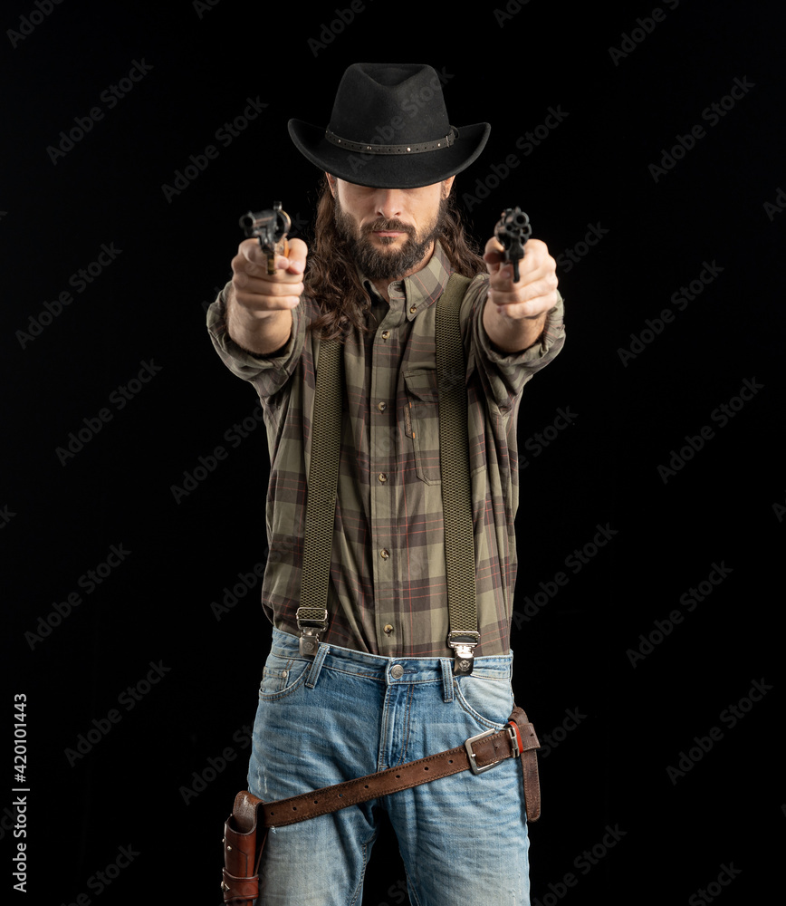Cowboy with guns. Studio shooting Cowboy with guns. Studio shooting