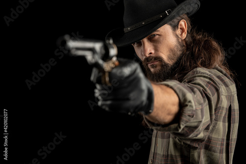 Cowboy with guns. Studio shooting