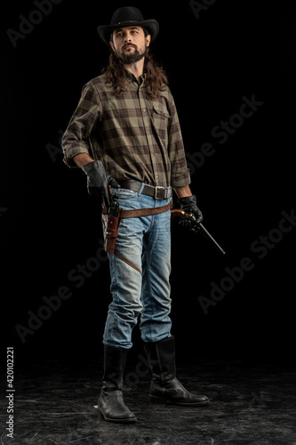 Cowboy with guns. Studio shooting © algrigo