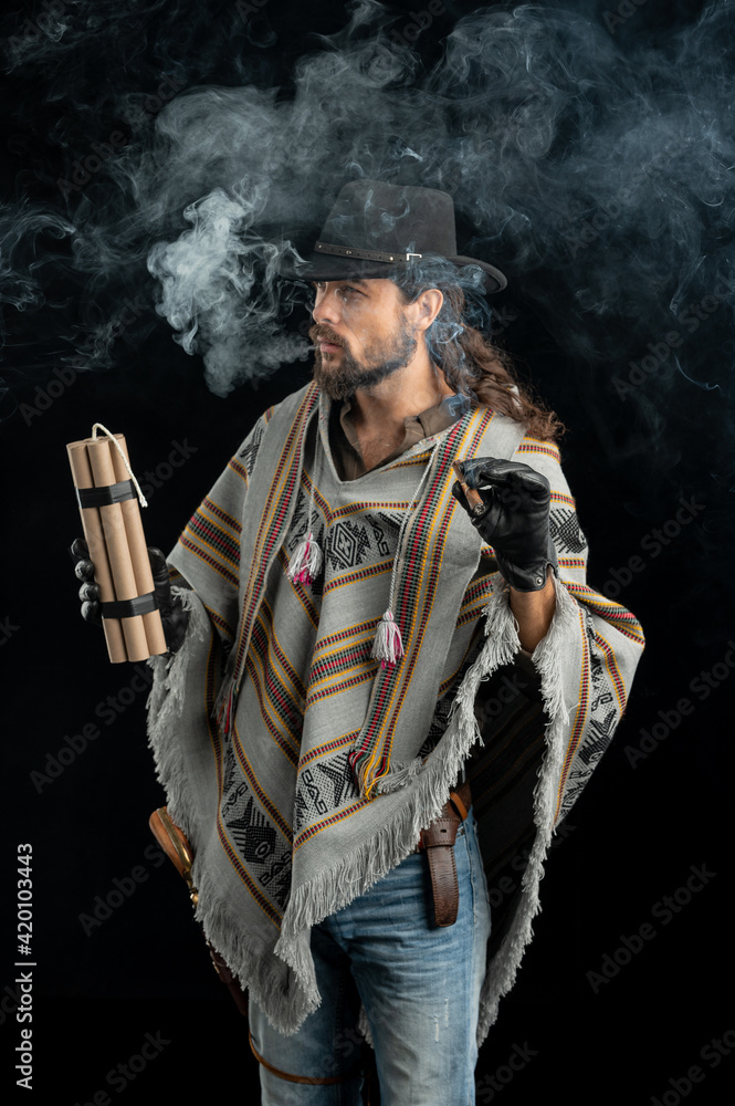 Fototapeta premium Cowboy with guns. Studio shooting
