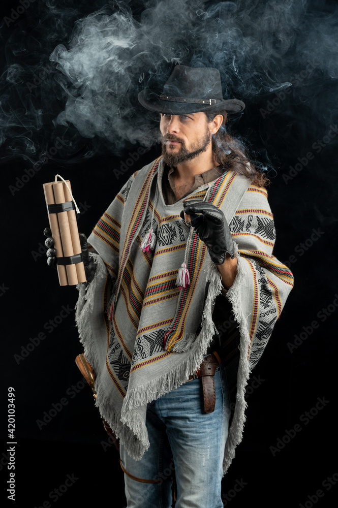Fototapeta premium Cowboy with guns. Studio shooting