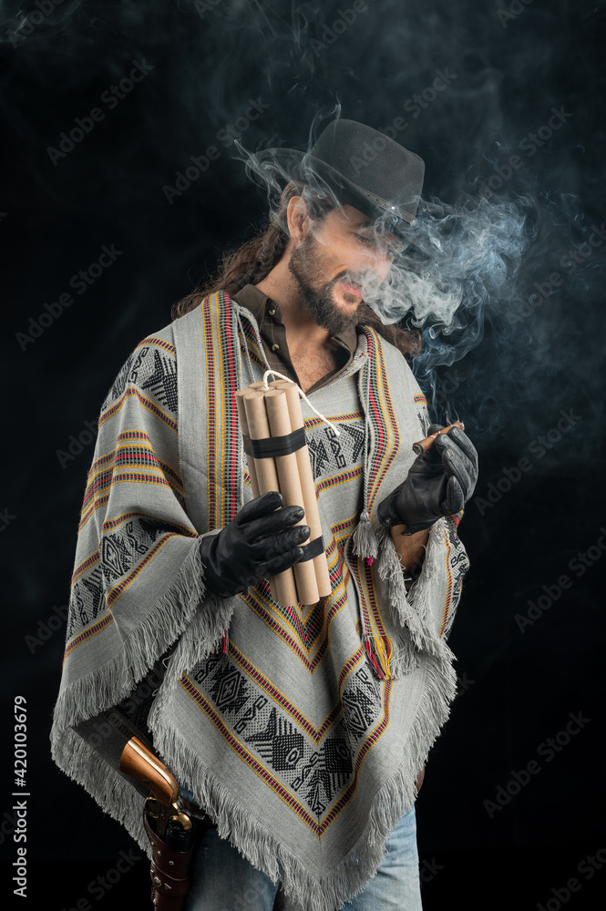 Fototapeta premium Cowboy with guns. Studio shooting