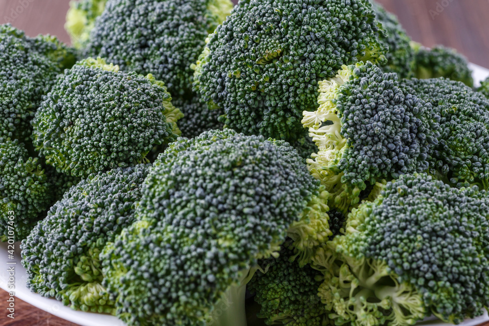 A lot of broccoli for diet and healthy eating. Fresh green broccoli on a table.Broccoli vegetable is full of vitamin.Vegetables for diet and healthy eating.Organic food. A lot of broccoli for diet and healthy eating. Fresh green broccoli on a table.Broccoli vegetable is full of vitamin.Vegetables for diet and healthy eating.Organic food.
