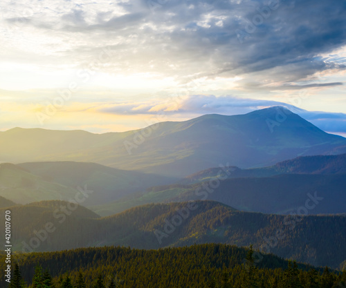 beautiful green mountain valley in blue mist at the sunset, beautiful travel background