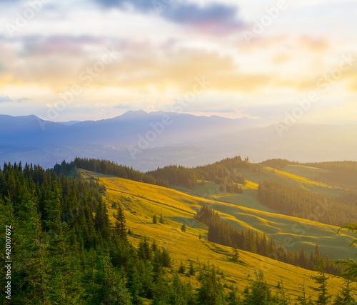 beautiful green mountain valley in blue mist at the sunset, beautiful travel background