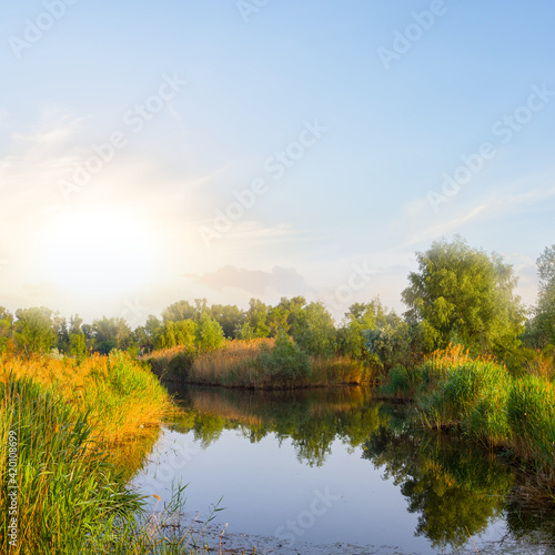 quiet small lake at the sunset, summer countryside landscape