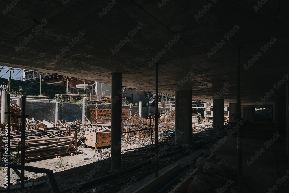 Construction site of multi-storey building with concrete slabs and columns. Men at work . Construction site of multi-storey building with concrete slabs and columns. Men at work .