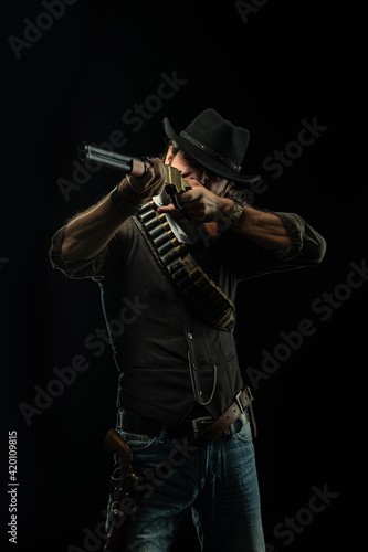 Cowboy with guns. Studio shooting