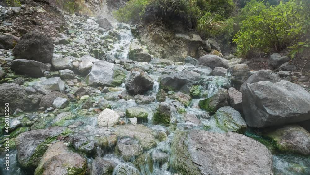 Sulphur springs with boiling water and rare green algae growing in the water. Sulphur springs with boiling water and rare green algae growing in the water.
