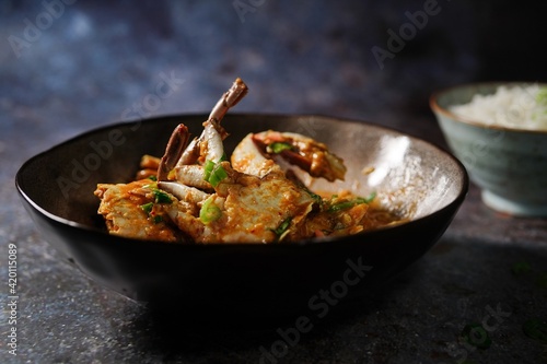 Homemade Singapore chilli crab served with jasmine rice, selective focus