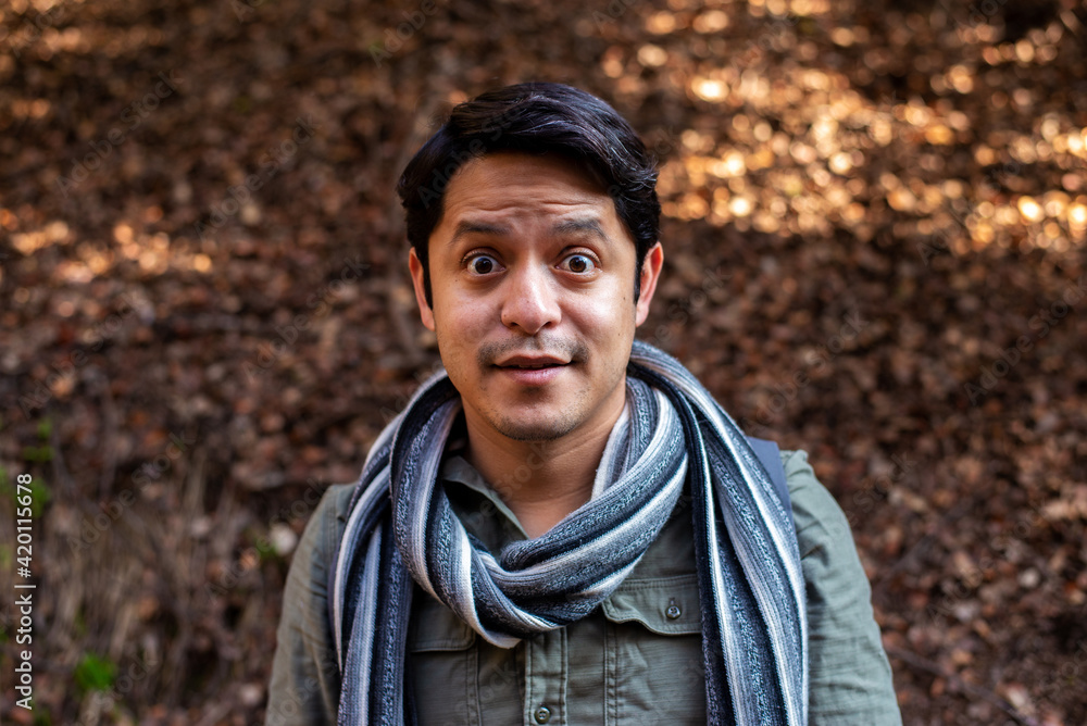 Portrait of a man in the forest with autumn leafs at the background Portrait of a man in the forest with autumn leafs at the background