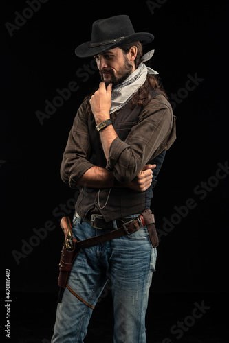 Cowboy with guns. Studio shooting © algrigo