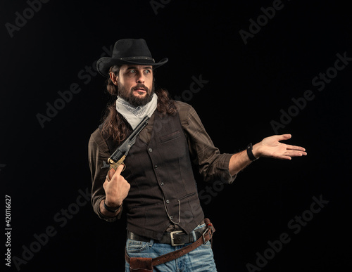 Cowboy with guns. Studio shooting