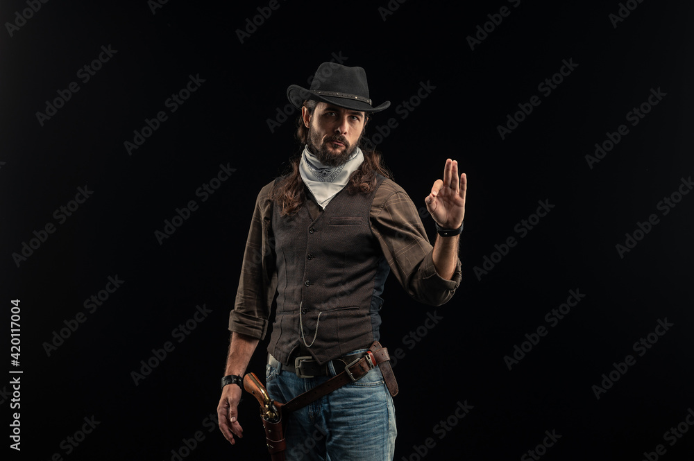 Cowboy with guns. Studio shooting Cowboy with guns. Studio shooting
