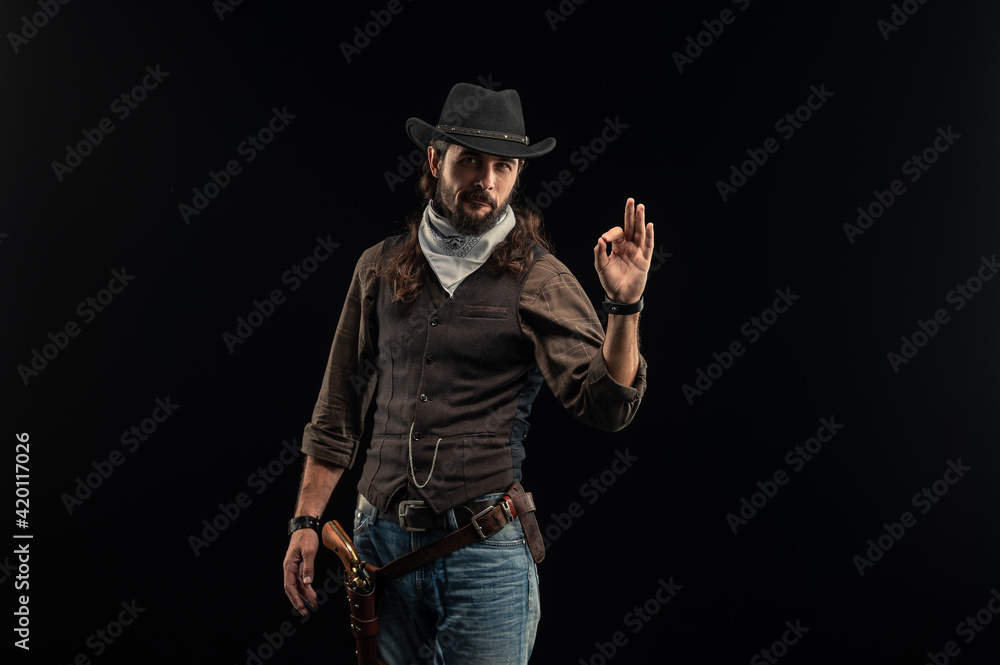 Cowboy with guns. Studio shooting Cowboy with guns. Studio shooting