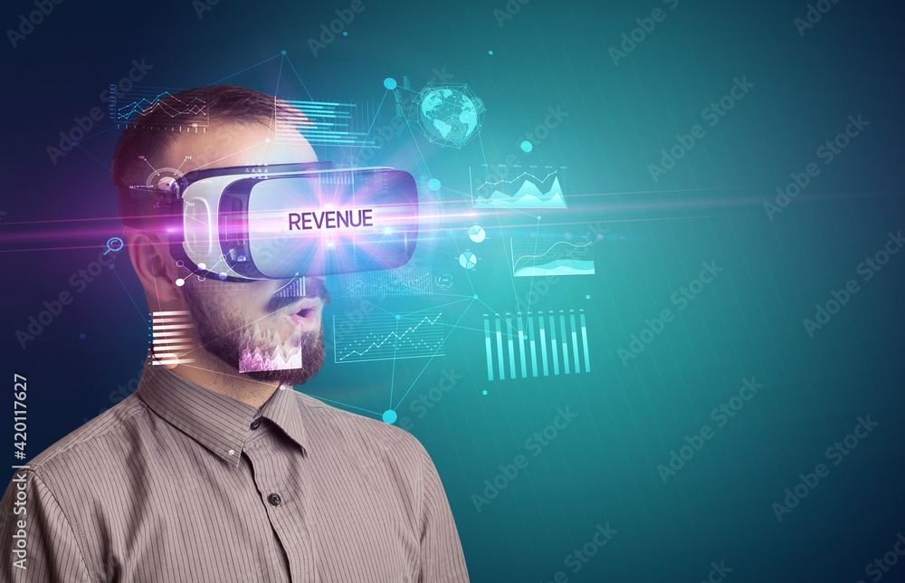 Businessman looking through Virtual Reality glasses Businessman looking through Virtual Reality glasses