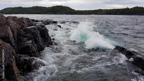 Waves bursting onto the coastline of the Lake Superior
