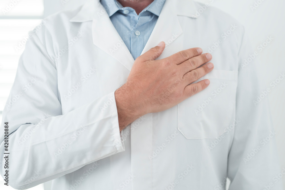 Unrecognizable man doctor portrait with man on heart - cardiologist professional job in white studio - prevention and healthcare concept therapy - healthy lifestyle to prevent disease Unrecognizable man doctor portrait with man on heart - cardiologist professional job in white studio - prevention and healthcare concept therapy - healthy lifestyle to prevent disease