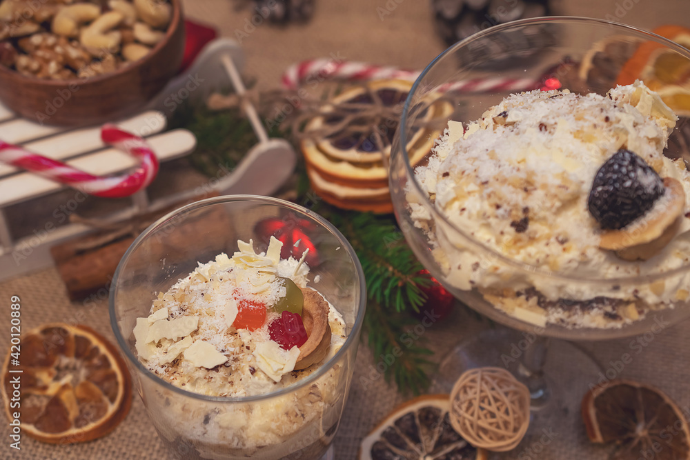 dessert with cream in glassware on christmas background dessert with cream in glassware on christmas background