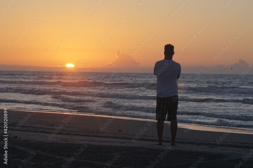 person enjoing sunrise at Wildwood beach