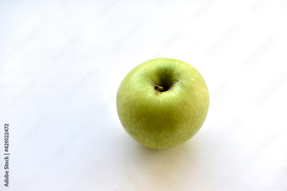 Green apple on white background with shadow Green apple on white background with shadow