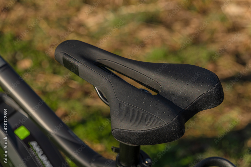 Black and gray electric bicycle in sunrise morning time on frosty field Black and gray electric bicycle in sunrise morning time on frosty field