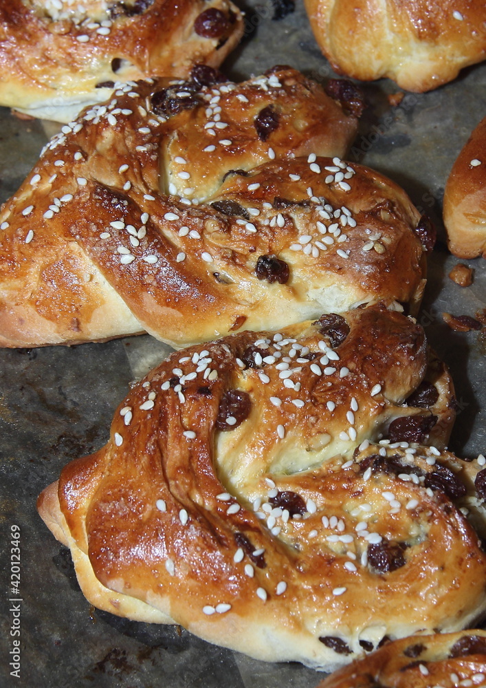 Sweet homemade pastry in the shape of hearts made from yeast dough and jam
