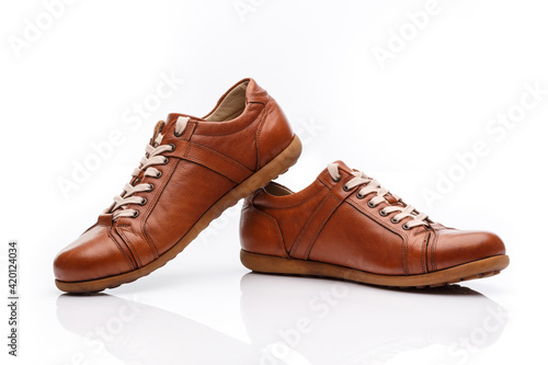 Wallpaper Mural Pair of brown leather men's shoes on a white background. Torontodigital.ca