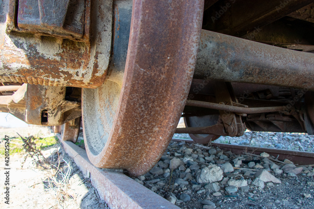 Closeup of the old rusty train wheels. Details of the wheel of train. Closeup of the old rusty train wheels. Details of the wheel of train.