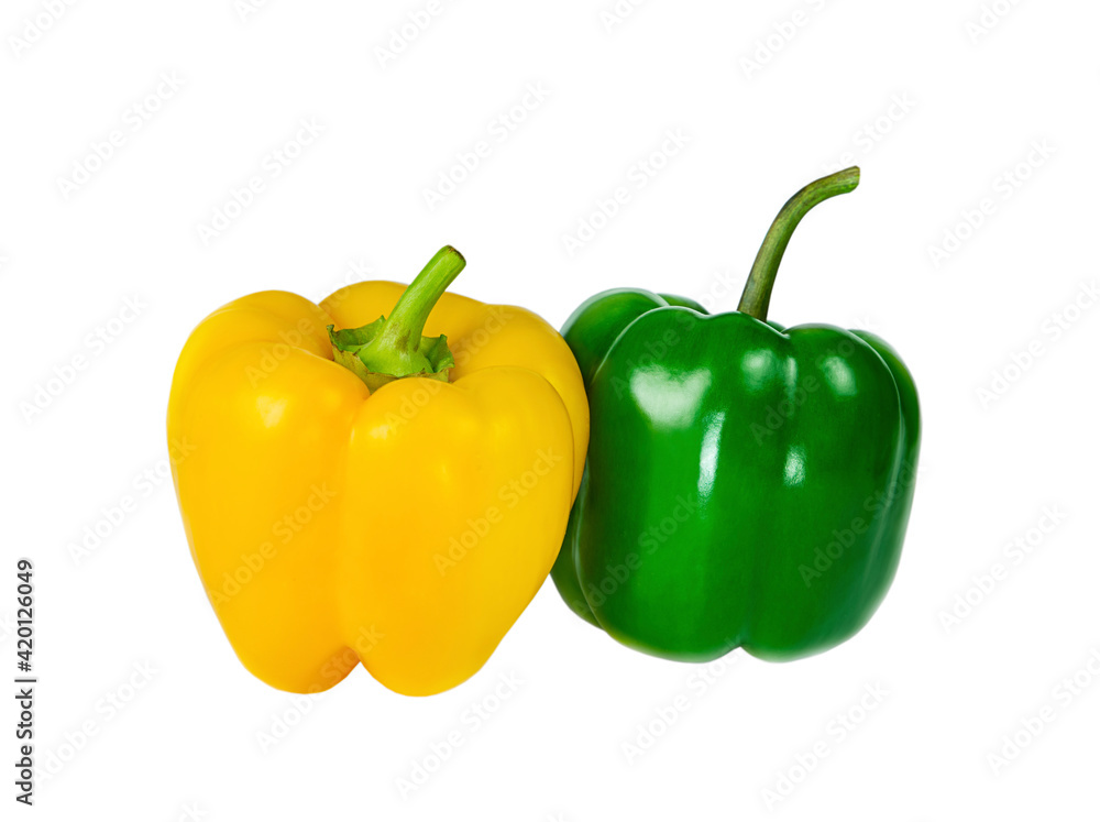 Bell peppers yellow and green isolated on white background. Bell peppers yellow and green isolated on white background.