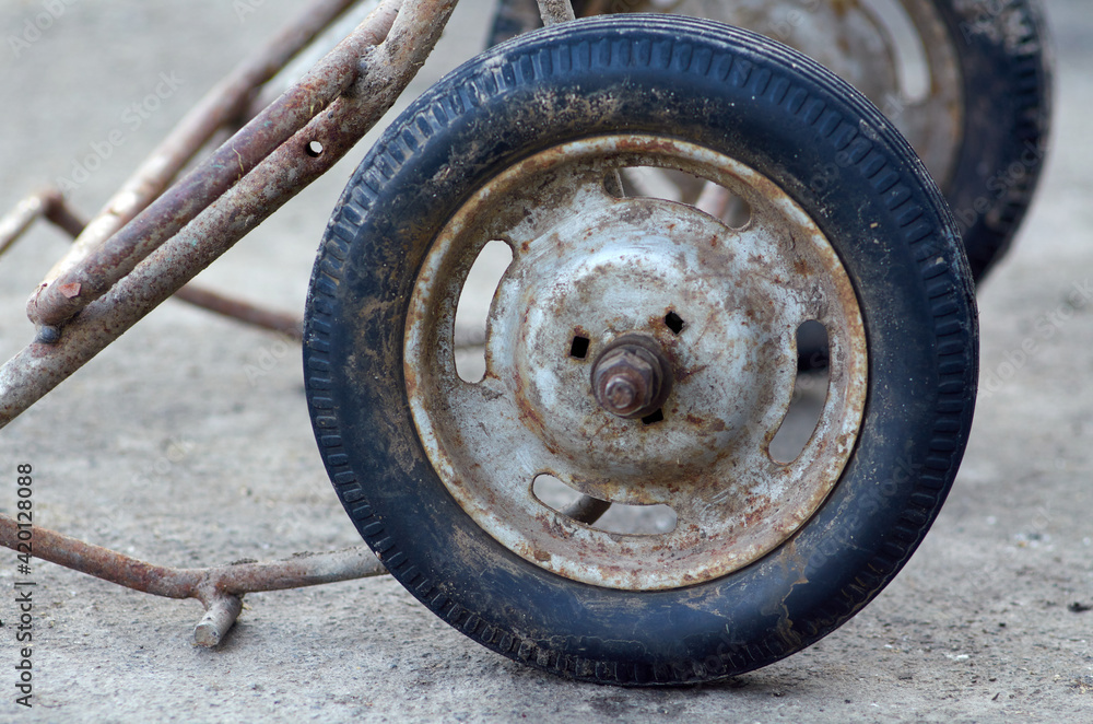Photo of a shopping cart wheel Photo of a shopping cart wheel