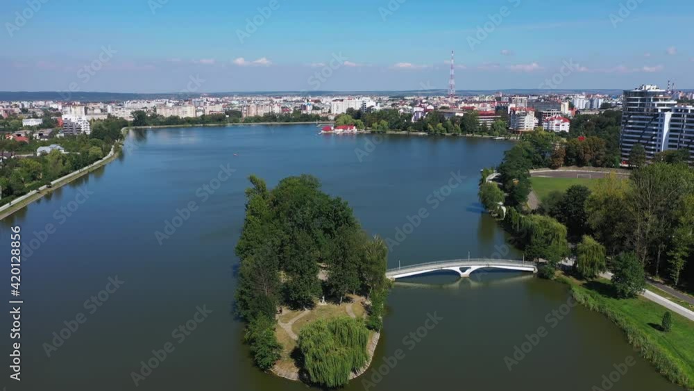 Big public lake and an island in the center of Ivano-Frankovsk city aerial view. Big public lake and an island in the center of Ivano-Frankovsk city aerial view.
