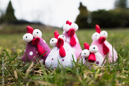 Group of handmade easter chicken made of polymer clay. Funny creative sculptures decoration.