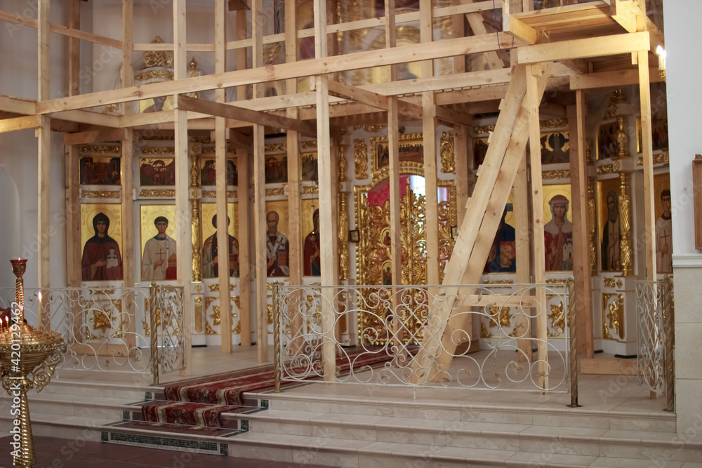A newly constructed building of the church scaffolding cladding domes chandelier A newly constructed building of the church scaffolding cladding domes chandelier